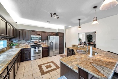 Welcome to this executive style 4 Bedroom, 3 Bath, 3 Car Garage on Crescent Oaks Country Club in Florida - for sale on GolfHomes.com, golf home, golf lot