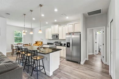 The beach is certainly within reach on this 3 bedroom, 2 bath, 2 on The Grand Club Cypress Course in Florida - for sale on GolfHomes.com, golf home, golf lot