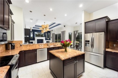 Nestled on a serene one-acre lot along the 6th fairway of on Evergreen Club in Florida - for sale on GolfHomes.com, golf home, golf lot