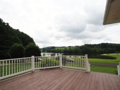 This exceptional home overlooks the 14th hole and beautiful lake on The Clubs of Olde Mill in Virginia - for sale on GolfHomes.com, golf home, golf lot