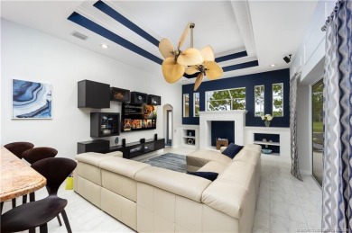 Nestled on a serene one-acre lot along the 6th fairway of on Evergreen Club in Florida - for sale on GolfHomes.com, golf home, golf lot