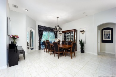 Nestled on a serene one-acre lot along the 6th fairway of on Evergreen Club in Florida - for sale on GolfHomes.com, golf home, golf lot