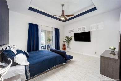Nestled on a serene one-acre lot along the 6th fairway of on Evergreen Club in Florida - for sale on GolfHomes.com, golf home, golf lot