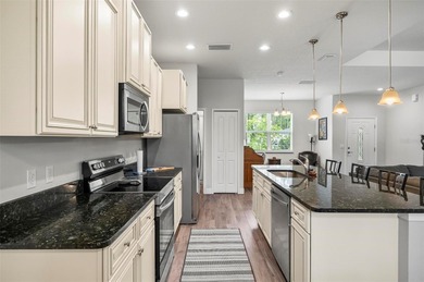 The beach is certainly within reach on this 3 bedroom, 2 bath, 2 on The Grand Club Cypress Course in Florida - for sale on GolfHomes.com, golf home, golf lot