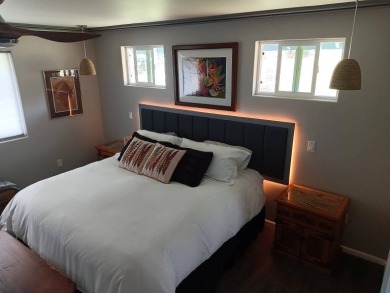 This 2022 beauty near the 18th tee with ocean and fairway views on Discovery Harbour Golf Course in Hawaii - for sale on GolfHomes.com, golf home, golf lot