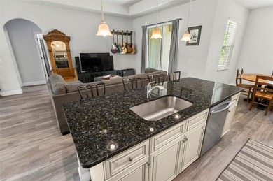 The beach is certainly within reach on this 3 bedroom, 2 bath, 2 on The Grand Club Cypress Course in Florida - for sale on GolfHomes.com, golf home, golf lot