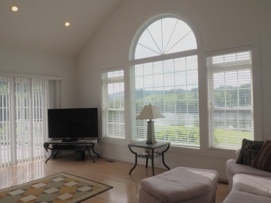 This exceptional home overlooks the 14th hole and beautiful lake on The Clubs of Olde Mill in Virginia - for sale on GolfHomes.com, golf home, golf lot
