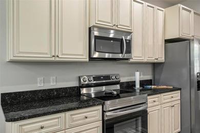 The beach is certainly within reach on this 3 bedroom, 2 bath, 2 on The Grand Club Cypress Course in Florida - for sale on GolfHomes.com, golf home, golf lot