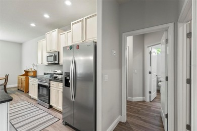 The beach is certainly within reach on this 3 bedroom, 2 bath, 2 on The Grand Club Cypress Course in Florida - for sale on GolfHomes.com, golf home, golf lot