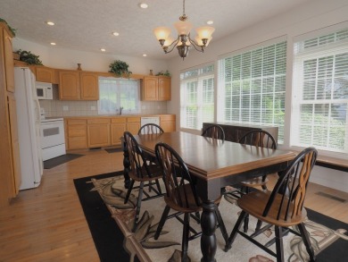 This exceptional home overlooks the 14th hole and beautiful lake on The Clubs of Olde Mill in Virginia - for sale on GolfHomes.com, golf home, golf lot