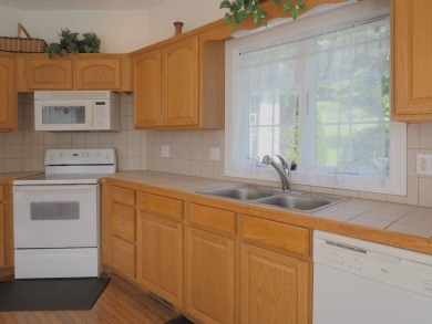 This exceptional home overlooks the 14th hole and beautiful lake on The Clubs of Olde Mill in Virginia - for sale on GolfHomes.com, golf home, golf lot