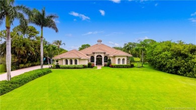 Nestled on a serene one-acre lot along the 6th fairway of on Evergreen Club in Florida - for sale on GolfHomes.com, golf home, golf lot