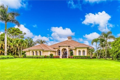 Nestled on a serene one-acre lot along the 6th fairway of on Evergreen Club in Florida - for sale on GolfHomes.com, golf home, golf lot