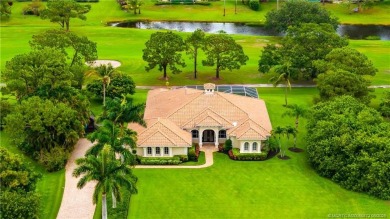 Nestled on a serene one-acre lot along the 6th fairway of on Evergreen Club in Florida - for sale on GolfHomes.com, golf home, golf lot