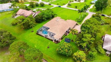 Nestled on a serene one-acre lot along the 6th fairway of on Evergreen Club in Florida - for sale on GolfHomes.com, golf home, golf lot