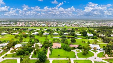 Nestled on a serene one-acre lot along the 6th fairway of on Evergreen Club in Florida - for sale on GolfHomes.com, golf home, golf lot
