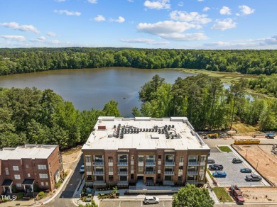 Step into the enchanting embrace of Lake Shore Lakeside VIEW on Lonnie Poole Golf Course in North Carolina - for sale on GolfHomes.com, golf home, golf lot