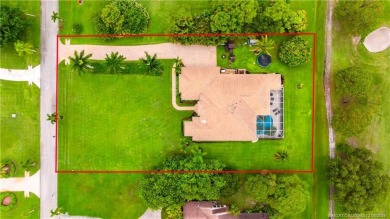 Nestled on a serene one-acre lot along the 6th fairway of on Evergreen Club in Florida - for sale on GolfHomes.com, golf home, golf lot