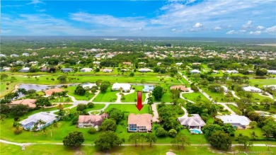 Nestled on a serene one-acre lot along the 6th fairway of on Evergreen Club in Florida - for sale on GolfHomes.com, golf home, golf lot