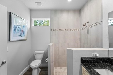 The beach is certainly within reach on this 3 bedroom, 2 bath, 2 on The Grand Club Cypress Course in Florida - for sale on GolfHomes.com, golf home, golf lot