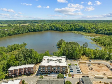 Step into the enchanting embrace of Lake Shore Lakeside VIEW on Lonnie Poole Golf Course in North Carolina - for sale on GolfHomes.com, golf home, golf lot