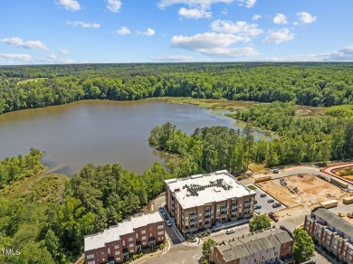 Step into the enchanting embrace of Lake Shore Lakeside VIEW on Lonnie Poole Golf Course in North Carolina - for sale on GolfHomes.com, golf home, golf lot