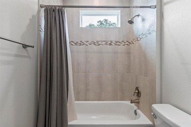 The beach is certainly within reach on this 3 bedroom, 2 bath, 2 on The Grand Club Cypress Course in Florida - for sale on GolfHomes.com, golf home, golf lot