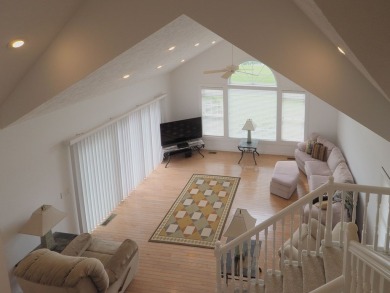This exceptional home overlooks the 14th hole and beautiful lake on The Clubs of Olde Mill in Virginia - for sale on GolfHomes.com, golf home, golf lot