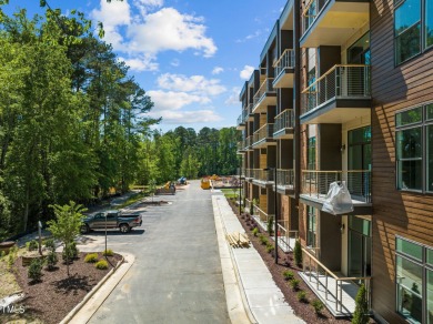 Step into the enchanting embrace of Lake Shore Lakeside VIEW on Lonnie Poole Golf Course in North Carolina - for sale on GolfHomes.com, golf home, golf lot