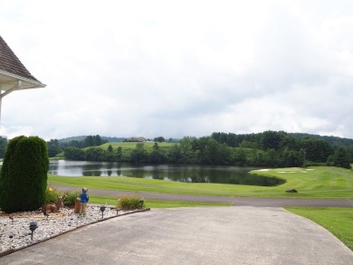 This exceptional home overlooks the 14th hole and beautiful lake on The Clubs of Olde Mill in Virginia - for sale on GolfHomes.com, golf home, golf lot