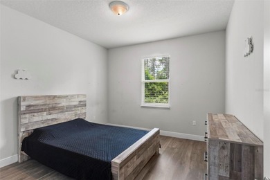 The beach is certainly within reach on this 3 bedroom, 2 bath, 2 on The Grand Club Cypress Course in Florida - for sale on GolfHomes.com, golf home, golf lot