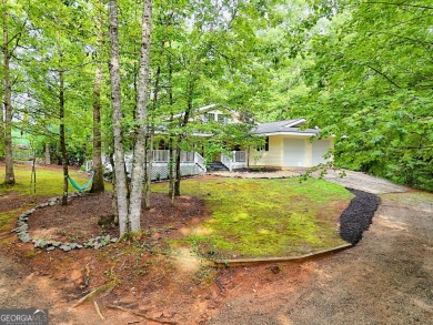 Nestled in Burton Getaways Community, this charming Fee Simple on Waterfall Country Club in Georgia - for sale on GolfHomes.com, golf home, golf lot