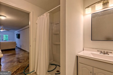 Nestled in Burton Getaways Community, this charming Fee Simple on Waterfall Country Club in Georgia - for sale on GolfHomes.com, golf home, golf lot