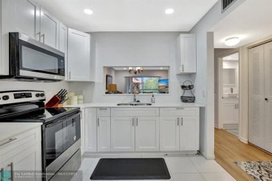 This  2 bd /1.5 bath features laminated floors throughout on Flamingo Lakes Country Club in Florida - for sale on GolfHomes.com, golf home, golf lot