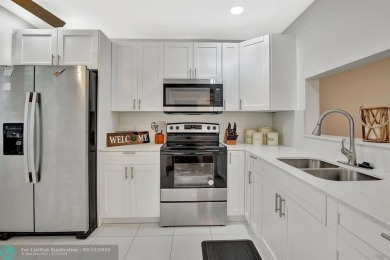 This  2 bd /1.5 bath features laminated floors throughout on Flamingo Lakes Country Club in Florida - for sale on GolfHomes.com, golf home, golf lot