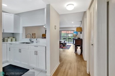 This  2 bd /1.5 bath features laminated floors throughout on Flamingo Lakes Country Club in Florida - for sale on GolfHomes.com, golf home, golf lot