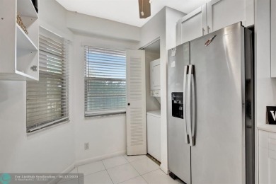 This  2 bd /1.5 bath features laminated floors throughout on Flamingo Lakes Country Club in Florida - for sale on GolfHomes.com, golf home, golf lot
