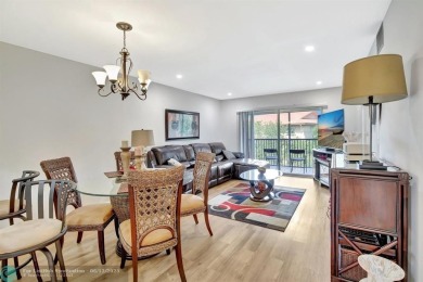This  2 bd /1.5 bath features laminated floors throughout on Flamingo Lakes Country Club in Florida - for sale on GolfHomes.com, golf home, golf lot