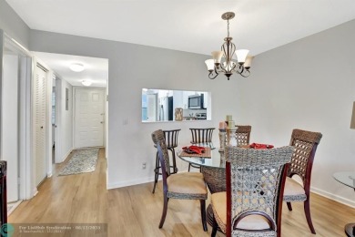 This  2 bd /1.5 bath features laminated floors throughout on Flamingo Lakes Country Club in Florida - for sale on GolfHomes.com, golf home, golf lot