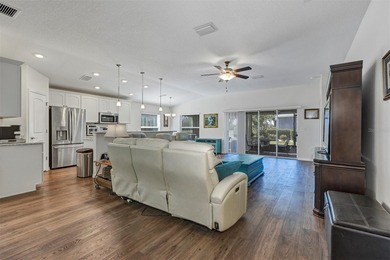 Welcome to a life that feels like vacation every day. Nestled in on Arlington Ridge Golf Club in Florida - for sale on GolfHomes.com, golf home, golf lot