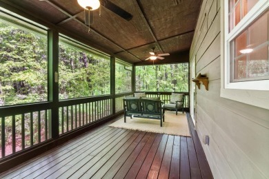 Located in Sapphire Valley, this 3-bedroom, 2.5-bathroom cabin on Sapphire National Golf Club in North Carolina - for sale on GolfHomes.com, golf home, golf lot