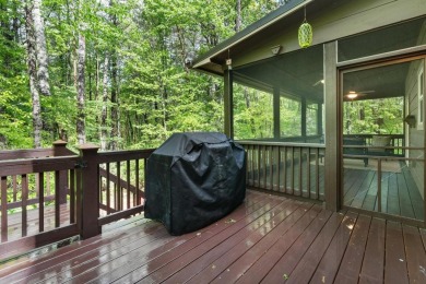 Located in Sapphire Valley, this 3-bedroom, 2.5-bathroom cabin on Sapphire National Golf Club in North Carolina - for sale on GolfHomes.com, golf home, golf lot