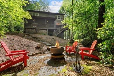 Located in Sapphire Valley, this 3-bedroom, 2.5-bathroom cabin on Sapphire National Golf Club in North Carolina - for sale on GolfHomes.com, golf home, golf lot