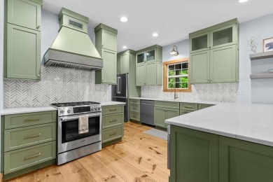 Located in Sapphire Valley, this 3-bedroom, 2.5-bathroom cabin on Sapphire National Golf Club in North Carolina - for sale on GolfHomes.com, golf home, golf lot