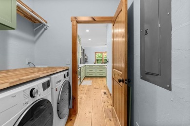 Located in Sapphire Valley, this 3-bedroom, 2.5-bathroom cabin on Sapphire National Golf Club in North Carolina - for sale on GolfHomes.com, golf home, golf lot