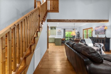 Located in Sapphire Valley, this 3-bedroom, 2.5-bathroom cabin on Sapphire National Golf Club in North Carolina - for sale on GolfHomes.com, golf home, golf lot