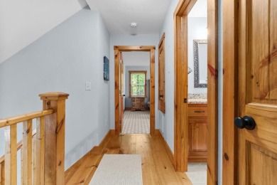 Located in Sapphire Valley, this 3-bedroom, 2.5-bathroom cabin on Sapphire National Golf Club in North Carolina - for sale on GolfHomes.com, golf home, golf lot