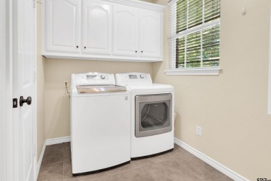 Welcome to your dream home in the charming Hideaway community! on Hide-A-Way Lake Golf Course in Texas - for sale on GolfHomes.com, golf home, golf lot