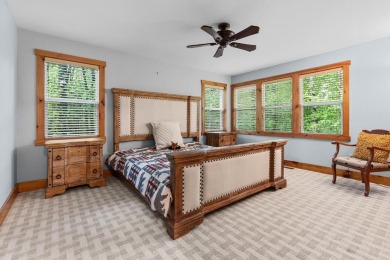 Located in Sapphire Valley, this 3-bedroom, 2.5-bathroom cabin on Sapphire National Golf Club in North Carolina - for sale on GolfHomes.com, golf home, golf lot