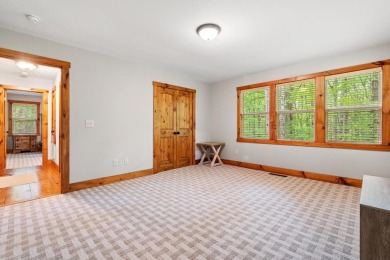 Located in Sapphire Valley, this 3-bedroom, 2.5-bathroom cabin on Sapphire National Golf Club in North Carolina - for sale on GolfHomes.com, golf home, golf lot